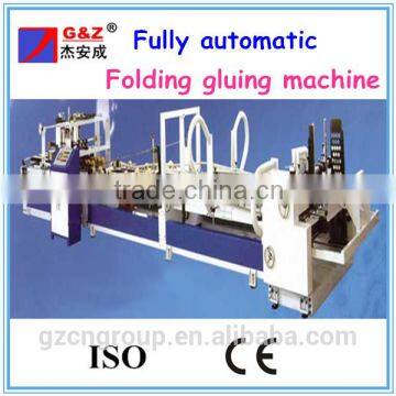 Folding and gluing machine for cardboard box