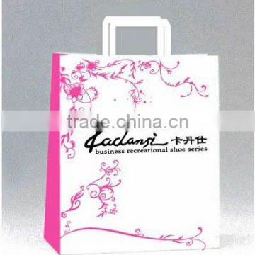 Handling shopping paper bag with printed