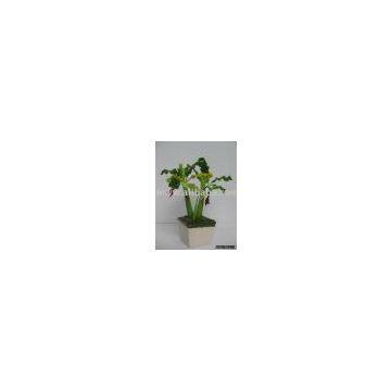 1 small artificial   banana plant set in pot