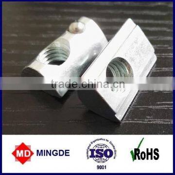 T slot nut with spring loaded ball