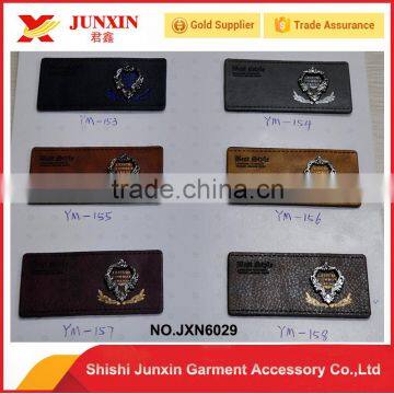 OEM and custom quality sew on jeans leather labels tags