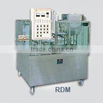 Rotary box filling and sealing machine