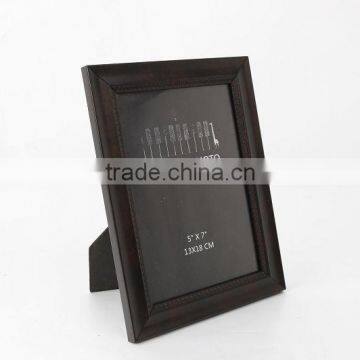 dark brown picture frame with easel on table dispaly