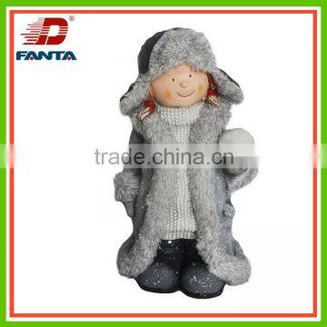 Standing magnesium winter child with felt hat