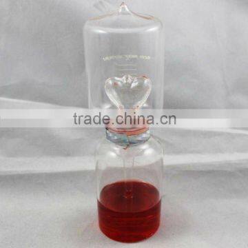 red heart shaped glass liquid thermometer