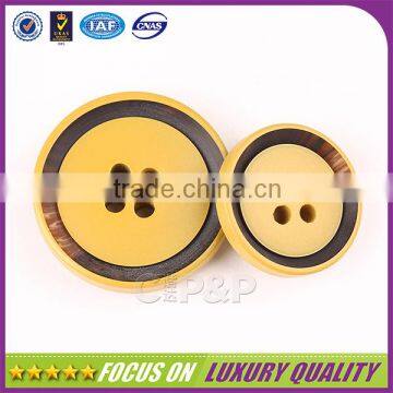 Yellow color plastic made polyester button for clothing