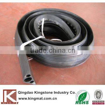 Low cost rubber speed hump cable protector