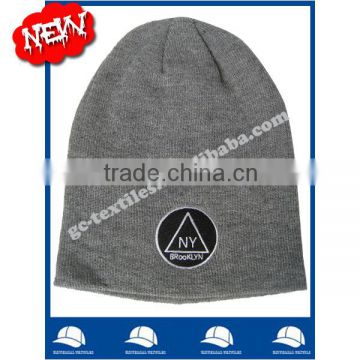 100% acrylic marl grey slouch beanie with flat embroidery logo no cuff with seam on back