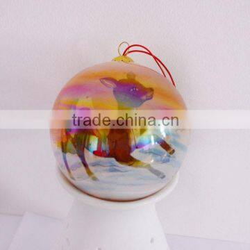 Painting christmas ball with animal inside