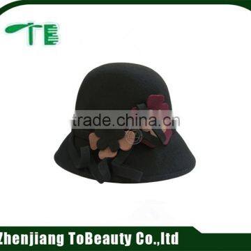 balck felt hat with flower accessory