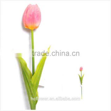 Artificial yellowish red tulip flower