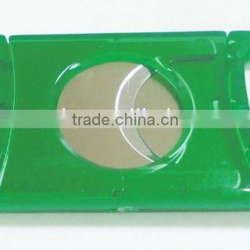 green transparent plastic cigar cutter