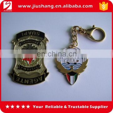 Wholesale customized metal badge clothing key chain for sale