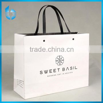 Recyclable medium hand length handle specialty paper bag for shopping packaging