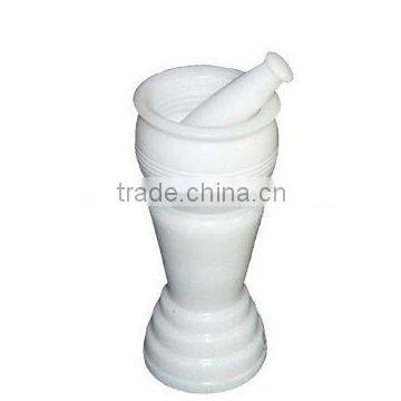 white marble mortar and pestle