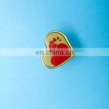 Heart-shaped nice metal badge with silkscreened text and logo