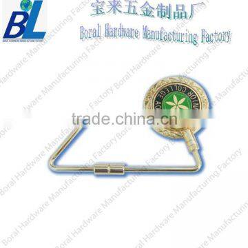 Twisted metal bag holder for ladies table decoration