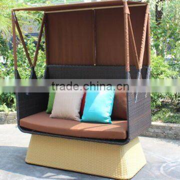 Outdoor rattan sunbed with cushion and throw pillow