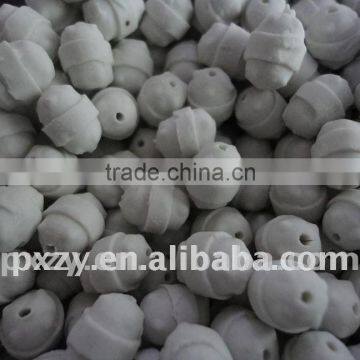 Perforated ceramic ball catalyst carrier