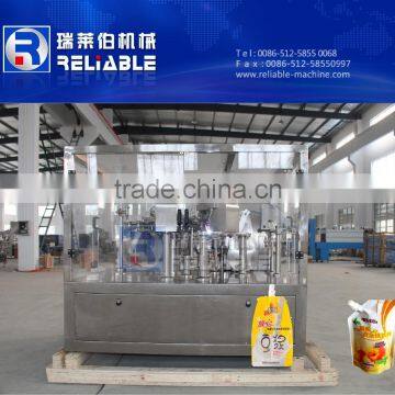 Stand up spout pouch filling and sealing machine