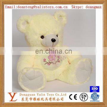 2015 cute design most popular plush stuffed toy light yellow teddy bear with wintersweet for girls