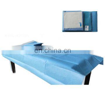 blue hospital treatment table disposable sheet