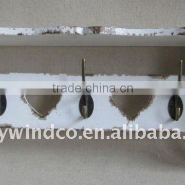 floating white distressed wooden wall shelf with hooks