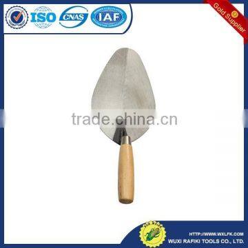 Professional construction tools brick with wood handle trowel