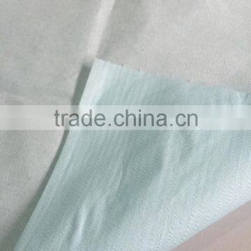 Embossed polyster wood pulp rolls