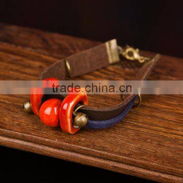 Retro Chinese Red Handmade Leather Ceramic Bead Bracelet With Bell on it photo-2
