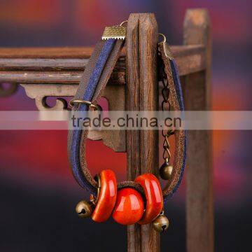 Retro Chinese Red Handmade Leather Ceramic Bead Bracelet With Bell on it photo-3