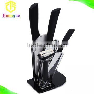 High quality kitchen ceramic knife set with 3 various sized knives, a peeler, and an acrylic holder