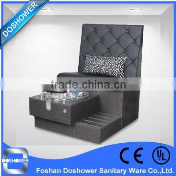 Doshower pedicure sink and black manicure tables and pedicure chairs