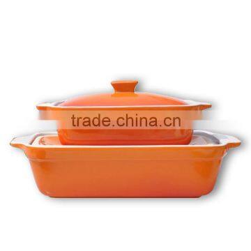 large ceramic baking pan with lid in orange color