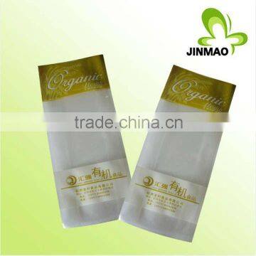 Header bag with roll adhesive