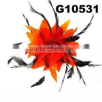 orange feather hair clip with long black feather