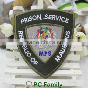 Prison service design badge