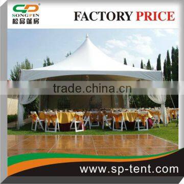 High Tops Traditional Marquees Anhcored by Spikes and Decorated With White Drappings