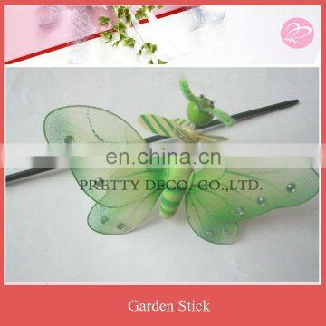 Green butterfly with small pinwheel garden stick decoration