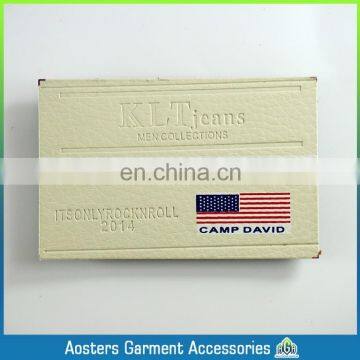 Custom sew on embossed leather label for jeans