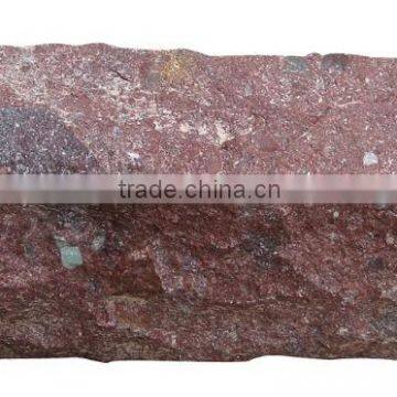 Kerb stone all sides natural split red porphyry