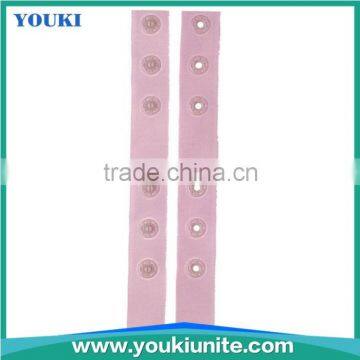 Plastic snap button with pink tape