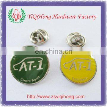 round metal pin logo