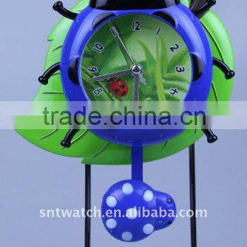 plastic beetle pendulum clock