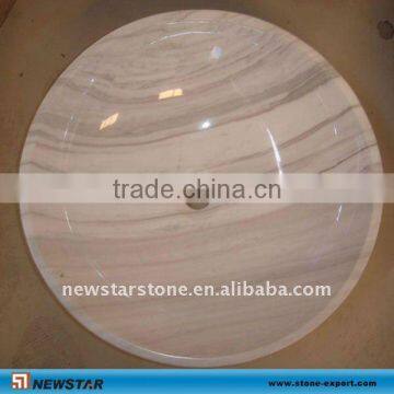 white marble vessel sinks