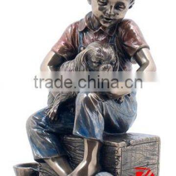 Bronze sitting boy feeding dog statue
