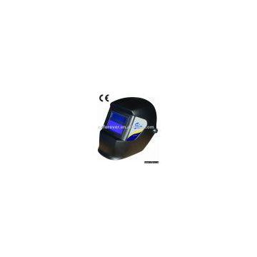 Solar powered auto-darkening welding helmet