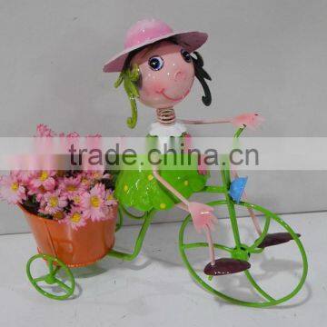 Functional little metal girl with bicycle