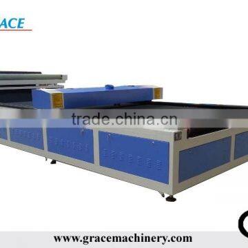 Fabric laser cutter with auto feeder and calibration system