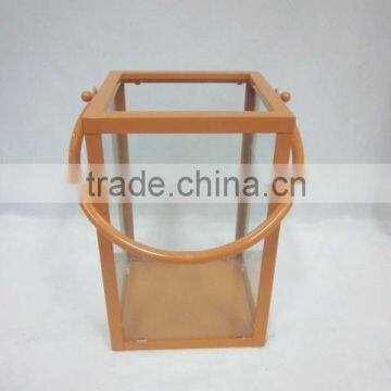 square metal lantern with clear glass piece